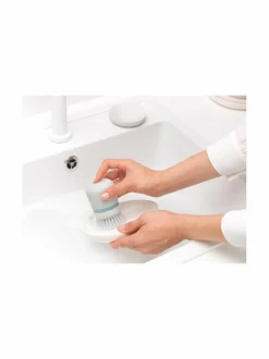 Saippuaa annosteleva tiskiharja